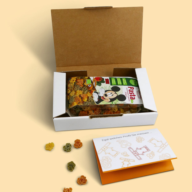 Box von PIXARGUS geöffnet: Micky Maus Pasta und Flyer zum ProfilControl DX ICSM.