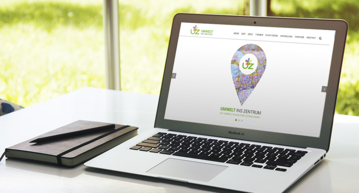 Websiteansicht von Umwelt-ins-Zentrum auf einem Laptop.
